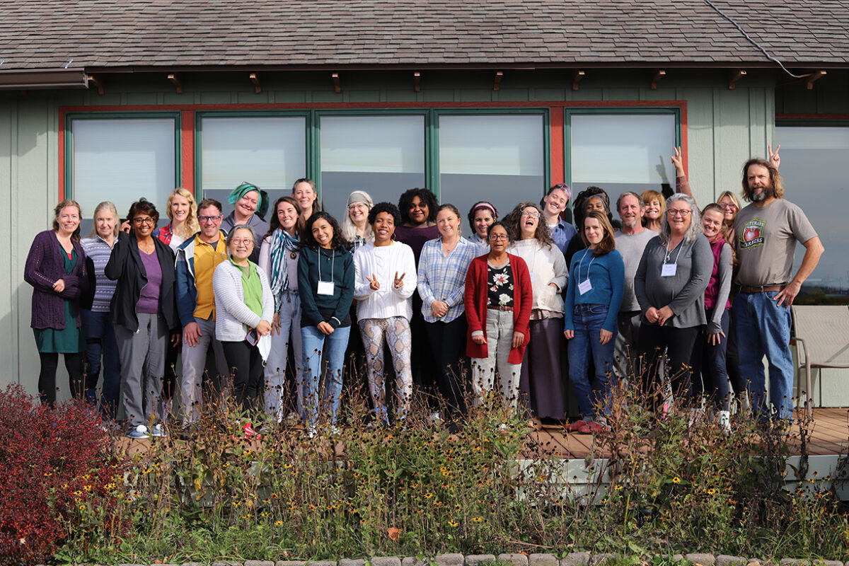 Group photo of about 25 adults