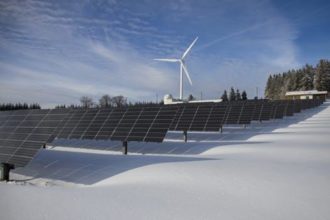 Wind Turbine Wind Turbine behind rows of solar panels